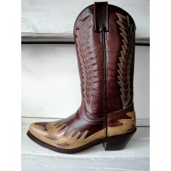 Leather cowboy boots in...